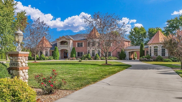 4703 W Kirby Ave, Champaign, IL 61822 - english style home featuring a front yard and stone siding