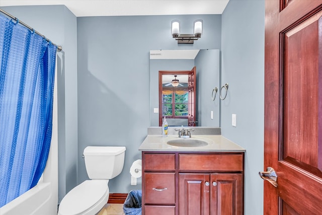 full bathroom with vanity, toilet, and shower / bath combo with shower curtain