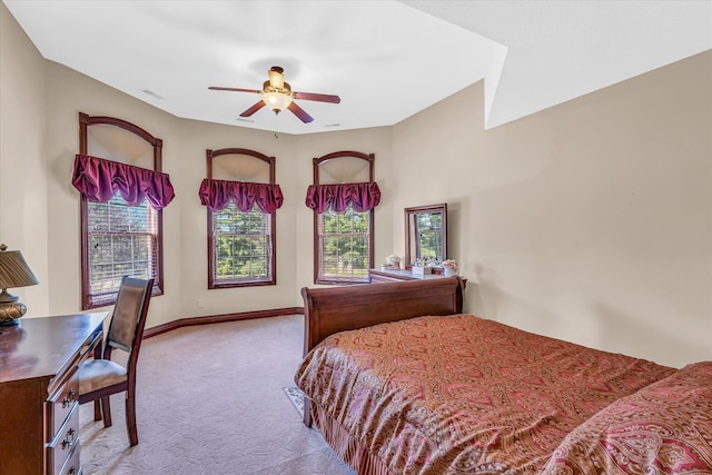 bedroom featuring ceiling fan and light carpet