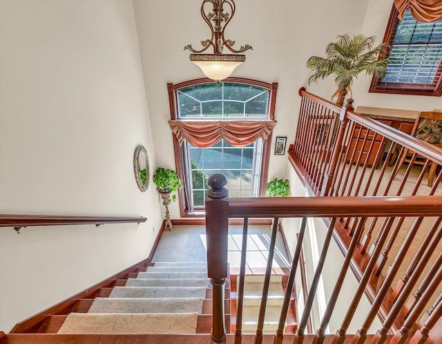 4703 W Kirby Ave, Champaign, IL 61822 - stairway featuring plenty of natural light and a high ceiling