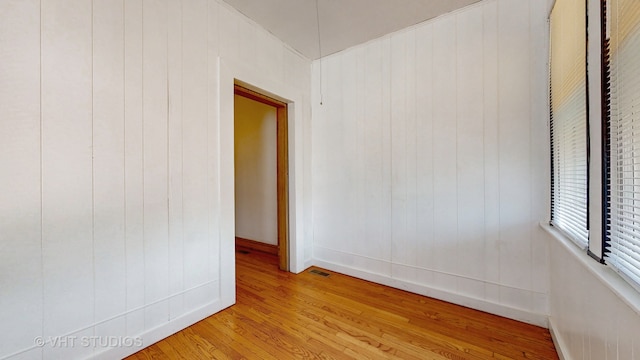 spare room featuring light hardwood / wood-style floors