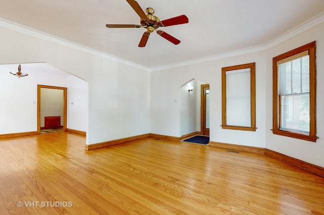 unfurnished room featuring light hardwood / wood-style flooring, ceiling fan, and ornamental molding