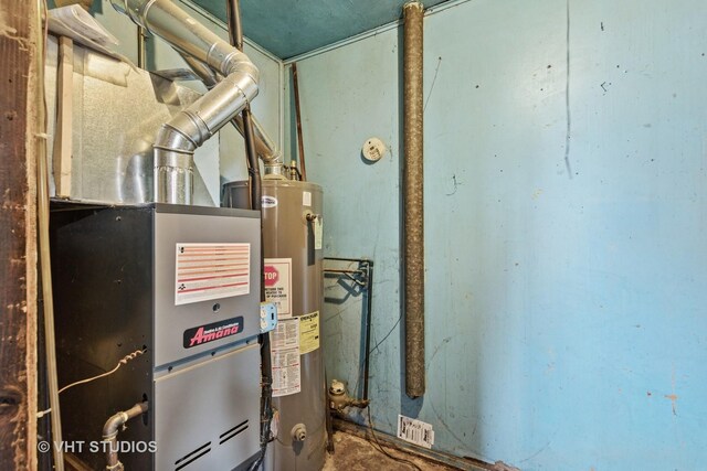 utility room with gas water heater