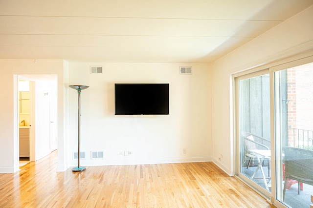 unfurnished living room with light hardwood / wood-style floors