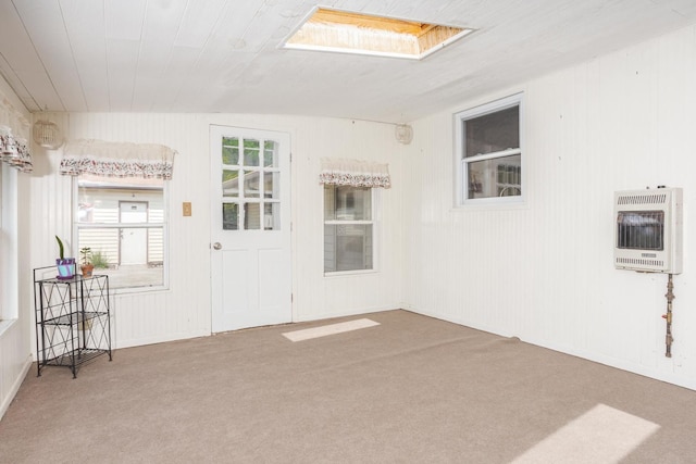 carpeted empty room with heating unit