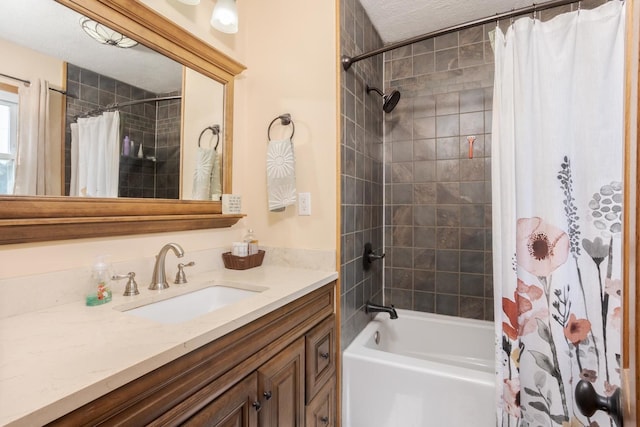 bathroom featuring shower / bath combo and vanity