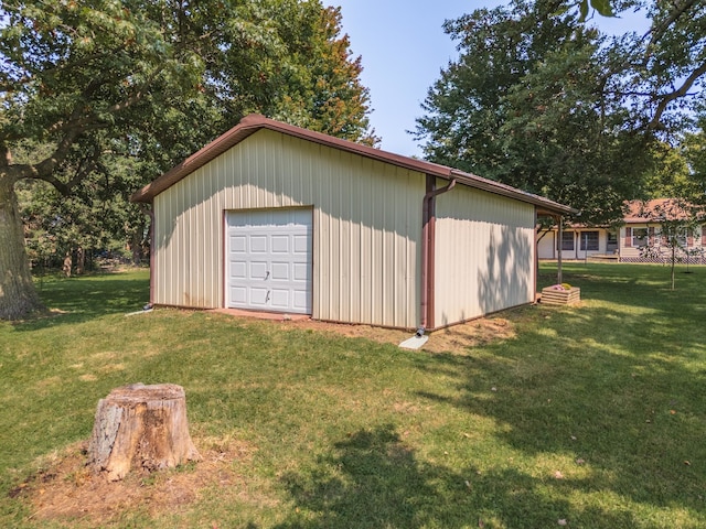 exterior space featuring an outdoor structure and driveway