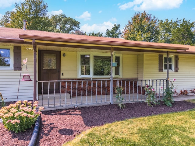 ranch-style home featuring covered porch