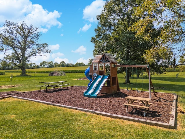 communal playground featuring a yard