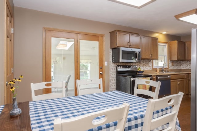 dining area featuring a skylight