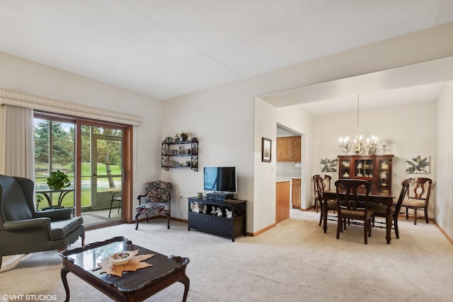 living room with a notable chandelier and light colored carpet