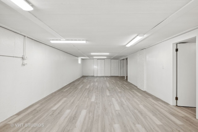 basement featuring light hardwood / wood-style floors