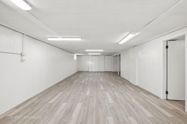 finished basement with light wood-type flooring