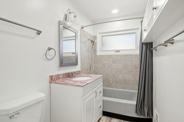 full bath featuring vanity, shower / bath combo, and toilet