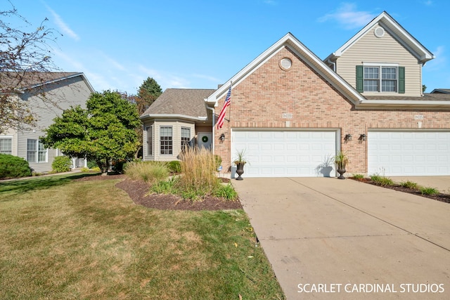 view of front of property featuring a garage and a front yard