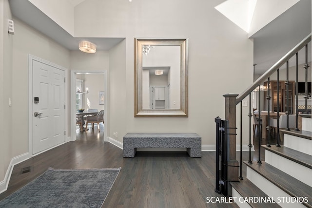 foyer entrance with dark hardwood / wood-style flooring