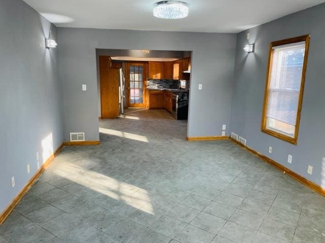 unfurnished living room with a wealth of natural light