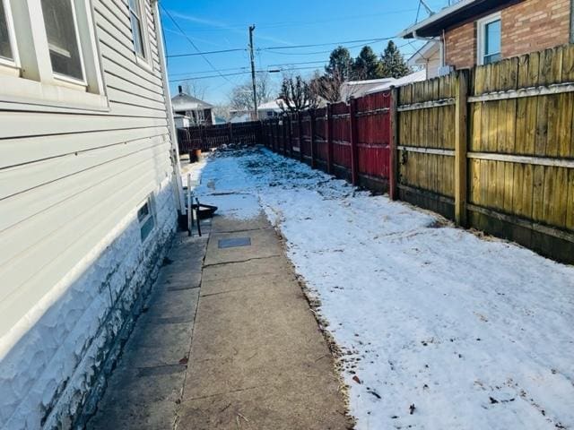 view of yard covered in snow