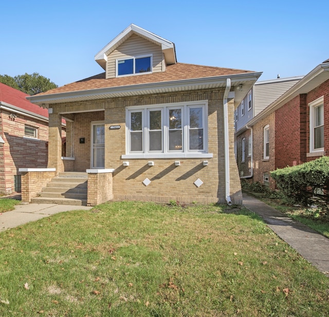 view of front of property with a front lawn