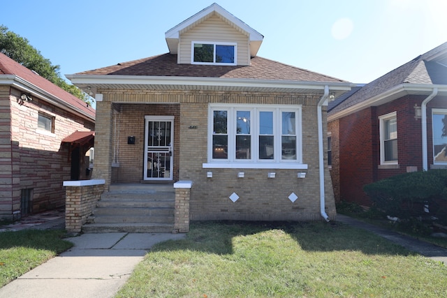 view of front of property with a front lawn