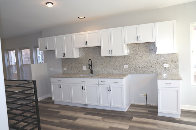 kitchen featuring white cabinetry, sink, and dark hardwood / wood-style floors