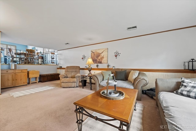 living room with carpet flooring and crown molding