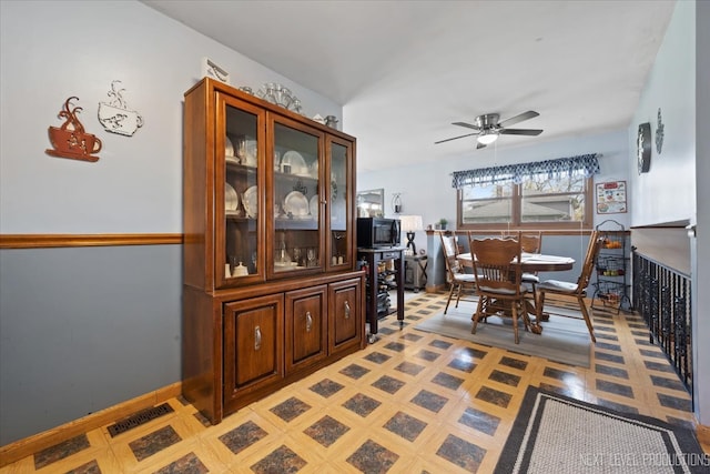 dining room featuring ceiling fan