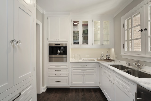 kitchen with white cabinets, appliances with stainless steel finishes, sink, and dark hardwood / wood-style flooring