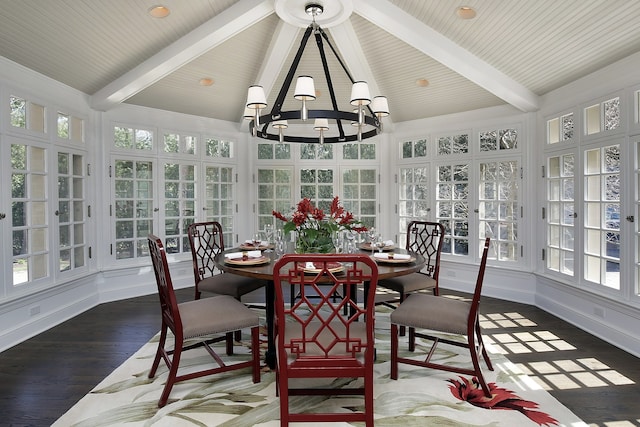 sunroom with vaulted ceiling with beams, a chandelier, and french doors