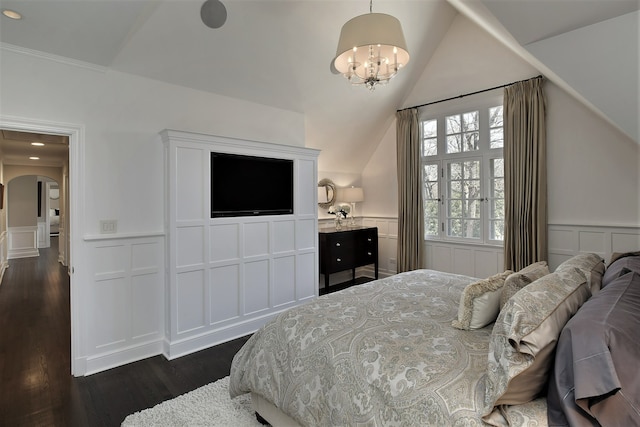 bedroom featuring an inviting chandelier, vaulted ceiling, and dark wood-type flooring