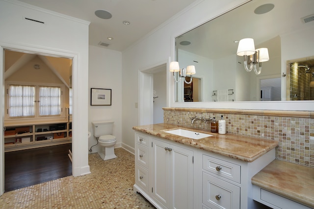 bathroom featuring a chandelier, tasteful backsplash, a shower, vanity, and toilet