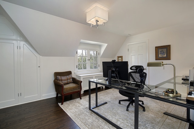 home office featuring vaulted ceiling and dark hardwood / wood-style floors