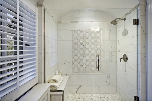 bathroom with a shower with shower door