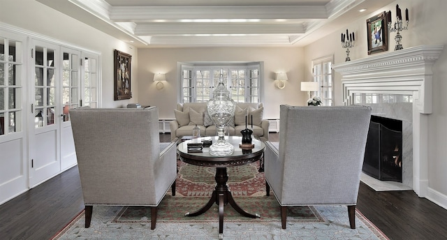 living area featuring coffered ceiling, dark hardwood / wood-style flooring, a high end fireplace, crown molding, and beam ceiling