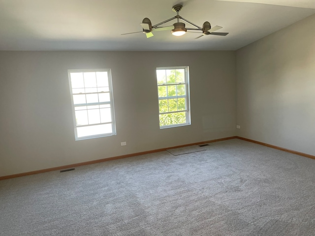 carpeted empty room with ceiling fan