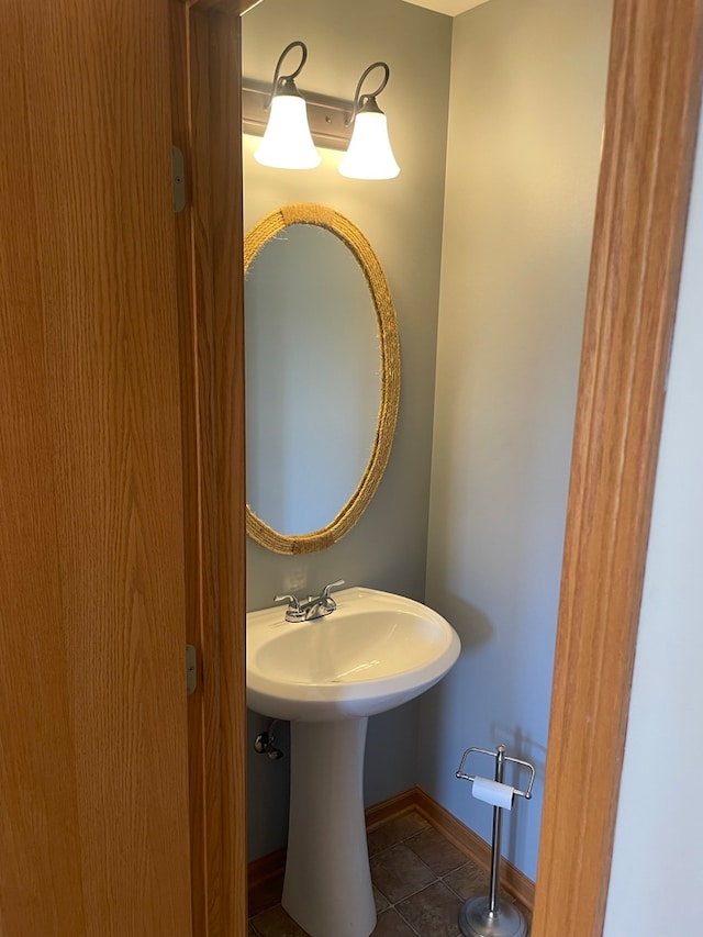 bathroom with tile patterned floors