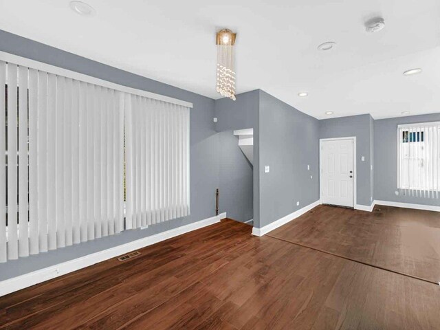 foyer entrance featuring wood-type flooring