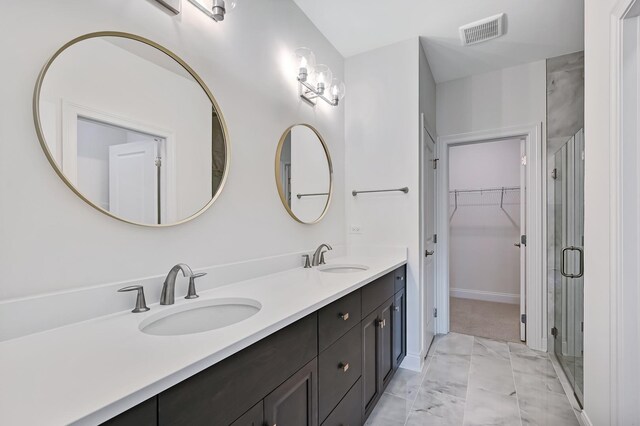 bathroom featuring vanity and walk in shower