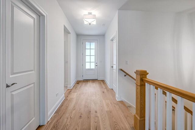 doorway to outside featuring light wood-type flooring