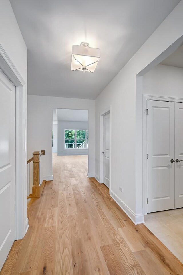 hallway with light wood-type flooring