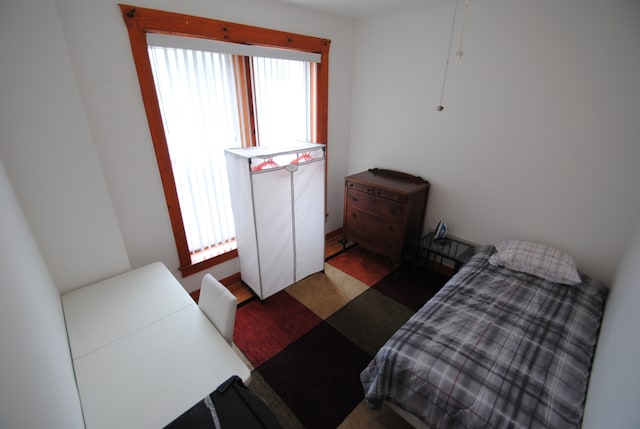 bedroom featuring multiple windows