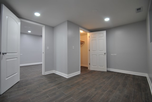 basement featuring dark hardwood / wood-style floors