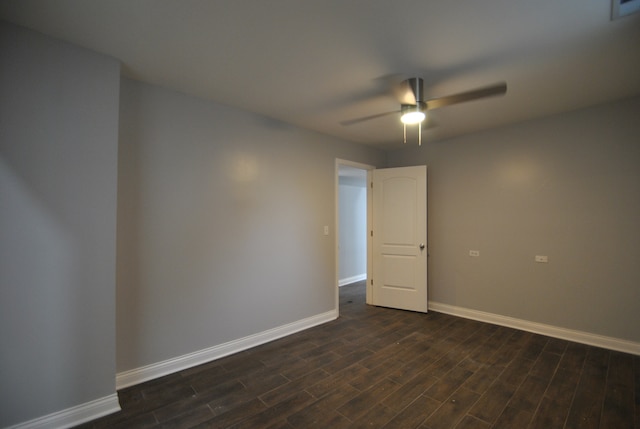 unfurnished room featuring ceiling fan and dark hardwood / wood-style flooring