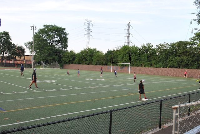 view of tennis court featuring basketball court