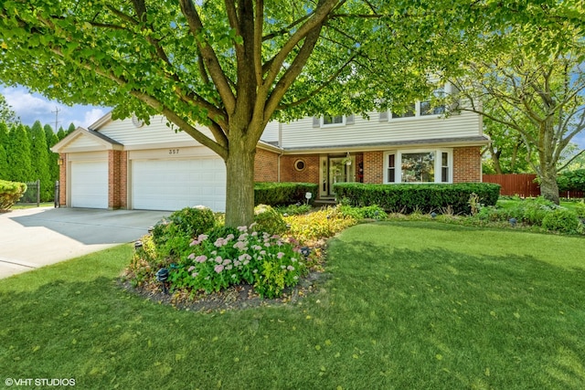 view of front of home featuring a garage and a front yard