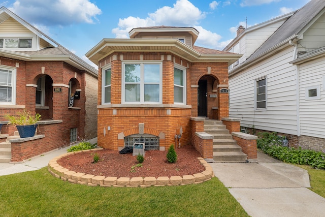 view of front of house with brick siding