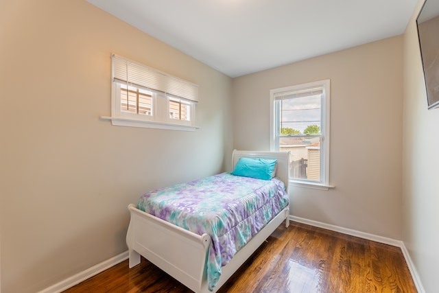 bedroom featuring dark hardwood / wood-style floors