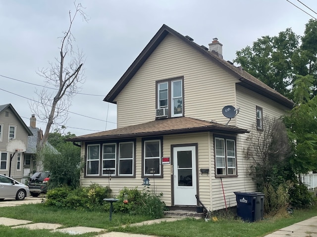 view of front of home featuring cooling unit