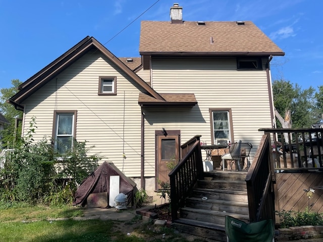 back of property featuring a deck