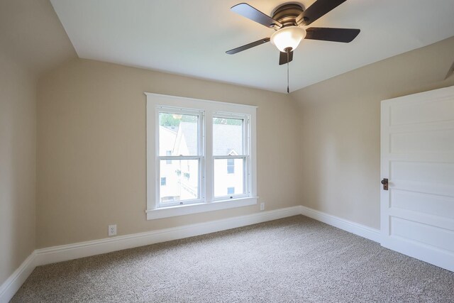 unfurnished bedroom featuring ceiling fan and carpet